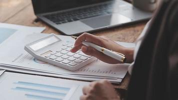 Financial analysts analyze business financial reports on a digital tablet planning investment project during a discussion at a meeting of corporate showing the results of their successful teamwork. video