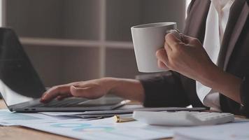 Financial analysts analyze business financial reports on a digital tablet planning investment project during a discussion at a meeting of corporate showing the results of their successful teamwork. video