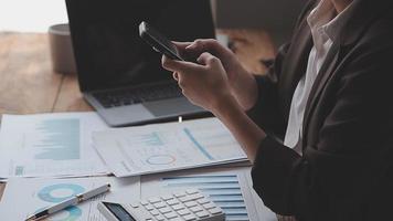Financial analysts analyze business financial reports on a digital tablet planning investment project during a discussion at a meeting of corporate showing the results of their successful teamwork. video