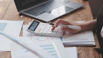 Financial analysts analyze business financial reports on a digital tablet planning investment project during a discussion at a meeting of corporate showing the results of their successful teamwork. video