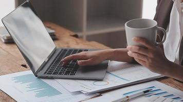 Financial analysts analyze business financial reports on a digital tablet planning investment project during a discussion at a meeting of corporate showing the results of their successful teamwork. video