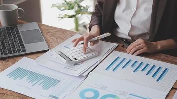 Financial analysts analyze business financial reports on a digital tablet planning investment project during a discussion at a meeting of corporate showing the results of their successful teamwork. video