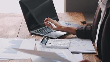 Financial analysts analyze business financial reports on a digital tablet planning investment project during a discussion at a meeting of corporate showing the results of their successful teamwork. video