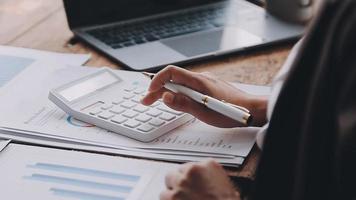 Financial analysts analyze business financial reports on a digital tablet planning investment project during a discussion at a meeting of corporate showing the results of their successful teamwork. video