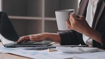 Financial analysts analyze business financial reports on a digital tablet planning investment project during a discussion at a meeting of corporate showing the results of their successful teamwork. video