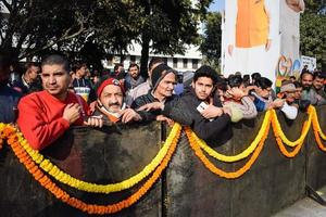 New Delhi, India - January 16 2023 - Thousands of people collected during Prime Minister Narendra Modi BJP road show, people during PM Modi big election rally in the capital photo