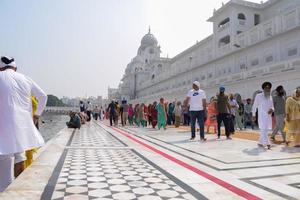 Amritsar, India - February 26 2023 - Unidentified devotees from various parts at Golden Temple - Harmandir Sahib in Amritsar, Punjab, India, Famous indian sikh landmark, Golden Temple photo