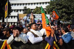 New Delhi, India - January 16 2023 - Thousands of people collected during Prime Minister Narendra Modi BJP road show, people during PM Modi big election rally in the capital photo