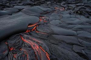 Lava was in the cracks of the earth to view the texture of the glow of volcanic magma in the cracks photo