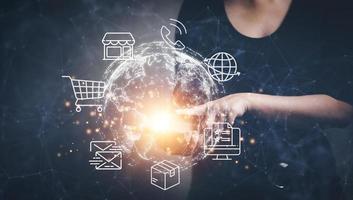New metaverse with icon business concept,Business hand holding a virtual globe with financial icons future technology, business goals, online communication,graph Screen Icon of a media screen,big data photo