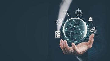 New metaverse with icon business concept,Business hand holding a virtual globe with financial icons future technology, business goals, online communication,graph Screen Icon of a media screen,big data photo