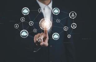 Businessman touch button Circular futuristic interface of smart home automation assistant on a virtual screen and a user touching a home button, digital big data and virtual technology, photo