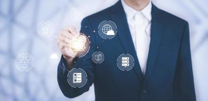 Businessman hand touch folder of document Management System,  online documentation database and process automation to efficiently manage files work, knowledge, Corporate business technology. photo