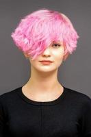 Young woman with pink hair photo
