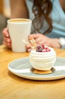 Sweet white cupcake with berries photo