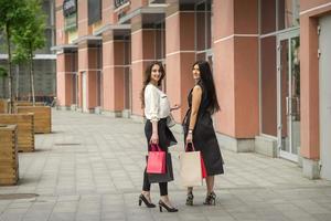 Two young women in shopping mall photo