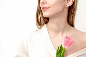 Woman with one pink tulip photo