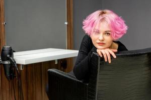 Woman with short pink hairstyle photo