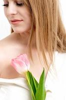 Woman with one pink tulip photo