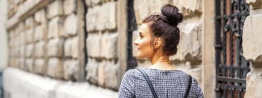 Young woman walks with backpack photo