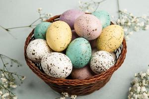 Pastel Easter eggs background. Spring greating card. Easter eggs in basket photo