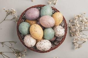 Pastel Easter eggs background. Spring greating card. Easter eggs in basket photo