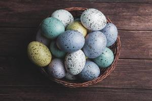 Pastel Easter eggs background. Spring greating card. Easter eggs in basket photo