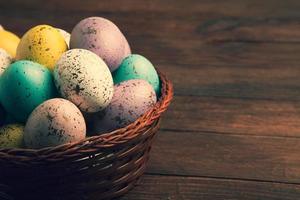 Pastel Easter eggs background. Spring greating card. Easter eggs in basket photo