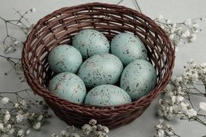 Pastel Easter eggs background. Spring greating card. Easter eggs in basket photo