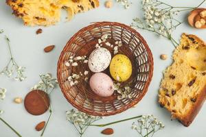 Pastel Easter eggs background. Spring greating card. Easter eggs in basket photo