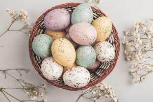 Pastel Easter eggs background. Spring greating card. Easter eggs in basket photo