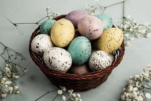 Pastel Easter eggs background. Spring greating card. Easter eggs in basket photo