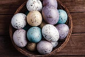 Pastel Easter eggs background. Spring greating card. Easter eggs in basket photo