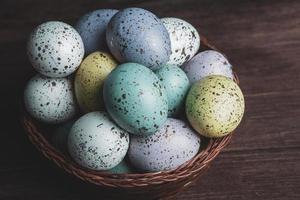 Pastel Easter eggs background. Spring greating card. Easter eggs in basket photo