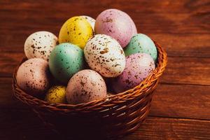 Pastel Easter eggs background. Spring greating card. Easter eggs in basket photo