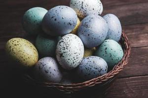 Pastel Easter eggs background. Spring greating card. Easter eggs in basket photo