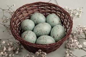 Pastel Easter eggs background. Spring greating card. Easter eggs in basket photo