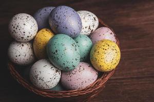 Pastel Easter eggs background. Spring greating card. Easter eggs in basket photo
