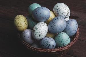 Pastel Easter eggs background. Spring greating card. Easter eggs in basket photo