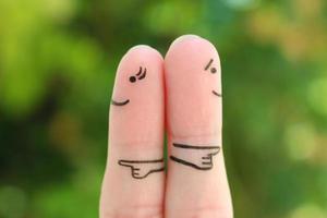 Fingers art of couple. Concept of a couple pointing in different directions. photo