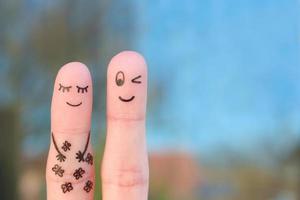 Fingers art of happy couple. Concept of butterfly in stomach. photo