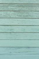 Green wooden background made of old boards for copying space. Mint color photo