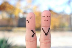 Fingers art of displeased couple. Woman was offended, man was guilty. photo