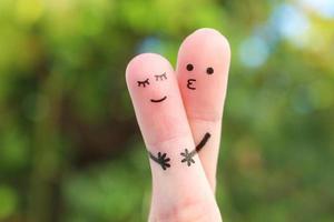 Fingers art of Happy couple. Man hugs and kisses woman. photo