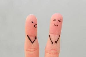 Fingers art of family during quarrel. Concept of wife shouts on husband, man laughs. photo