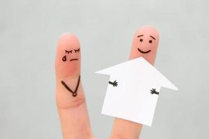 Finger art of family during quarrel. Concept of man and woman divide house after divorce. photo