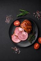 Delicious fresh baked meat roll with spices and herbs photo