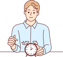 Smiling man points finger at alarm clock to remind of time management at works png