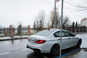 Gray BMW M 5 in street. photo