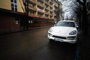 White Porsche Cayenne on street. photo